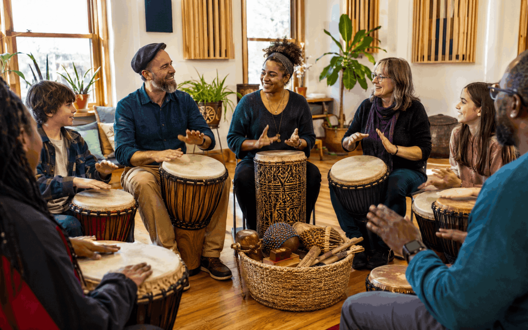 Facilitator leading an inclusive group drum circle session showing what sets Dan's drum lessons in Madison WI apart from traditional music instruction